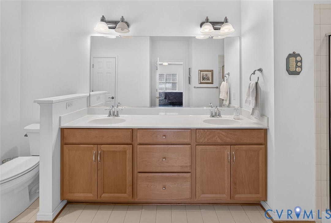 11116 Lantern Way, North Chesterfield, VA 23236 Dual vanity with undermount sinks, wood-finish cabinetry, and white countertops