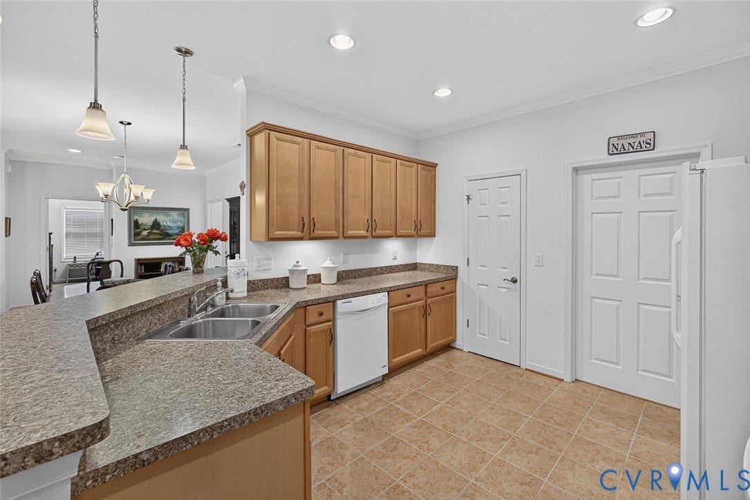 11116 Lantern Way, North Chesterfield, VA 23236 Kitchen featuring wood cabinetry, speckled countertops, dual basin sink, and tile flooring