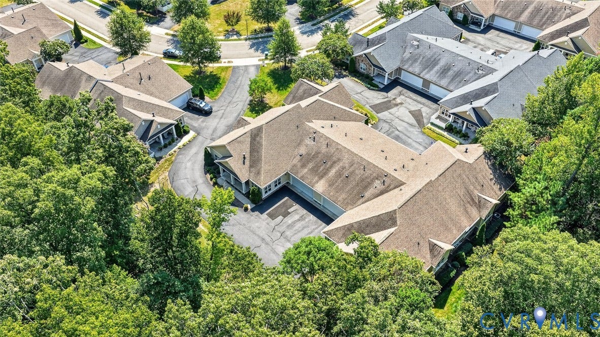11116 Lantern Way, North Chesterfield, VA 23236 Aerial perspective of a multi-unit property featuring pitched roofs, surrounded by mature trees, with paved driveways and parking areas