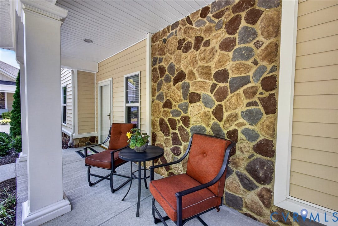 11116 Lantern Way, North Chesterfield, VA 23236 Covered porch featuring a stone-clad accent wall, siding exterior, and a white architectural column