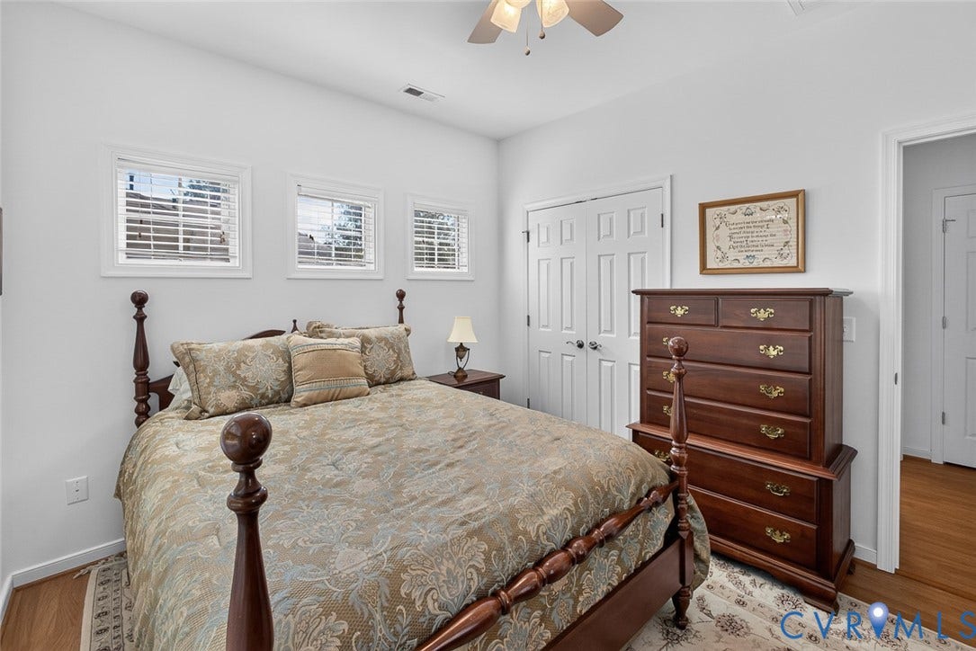 11116 Lantern Way, North Chesterfield, VA 23236 White walls with multiple windows, a ceiling fan, and a wood-finish floor