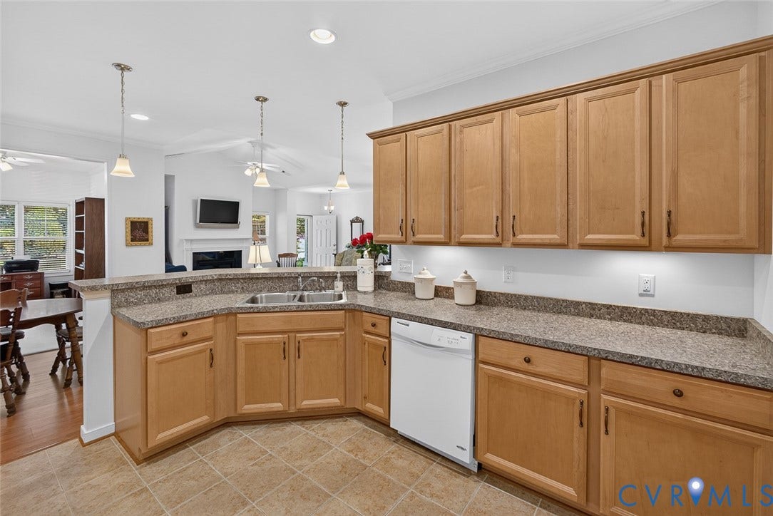 11116 Lantern Way, North Chesterfield, VA 23236 Kitchen featuring light wood cabinetry, speckled countertops, a double basin sink, and tile flooring
