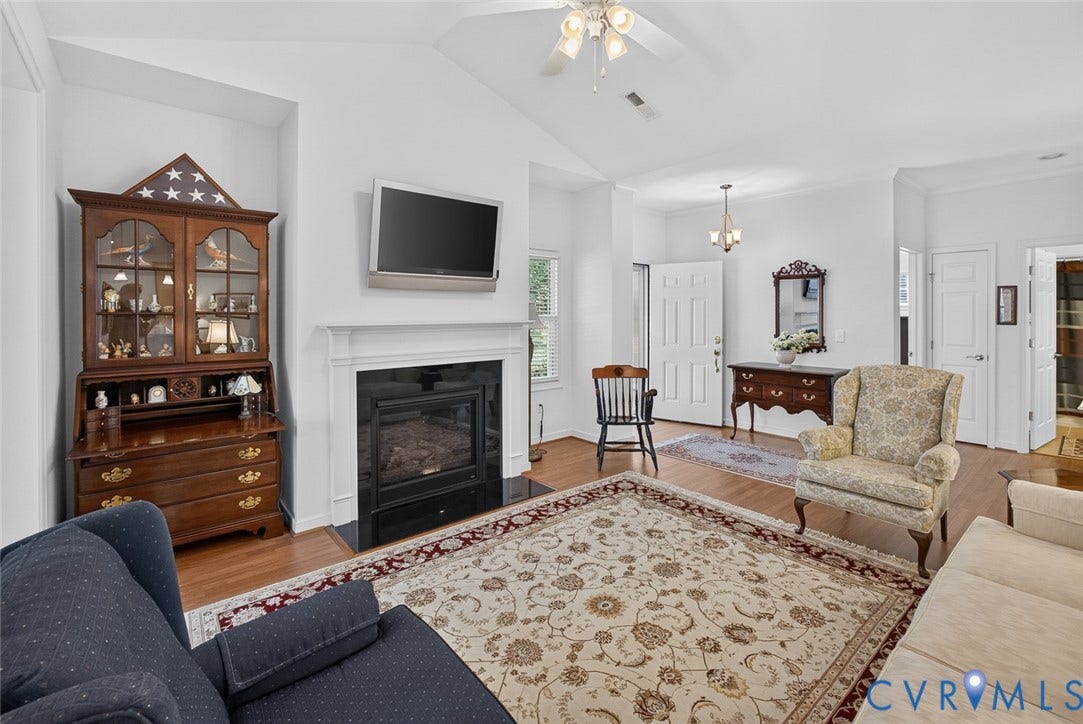 11116 Lantern Way, North Chesterfield, VA 23236 Vaulted ceilings, hardwood flooring, fireplace with white mantel, ceiling fan, and prominent front entry