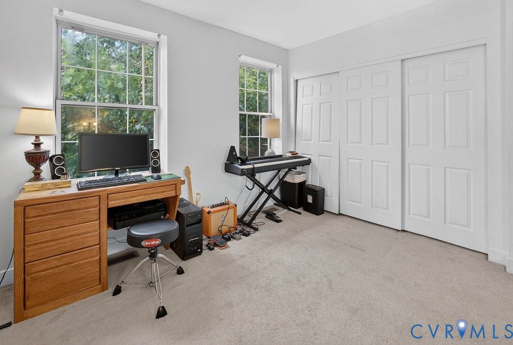 1826 Idlewood Avenue, Randolph, Richmond, VA 23220 Carpeted room featuring two windows, light-toned walls, and a multi-panel sliding closet door