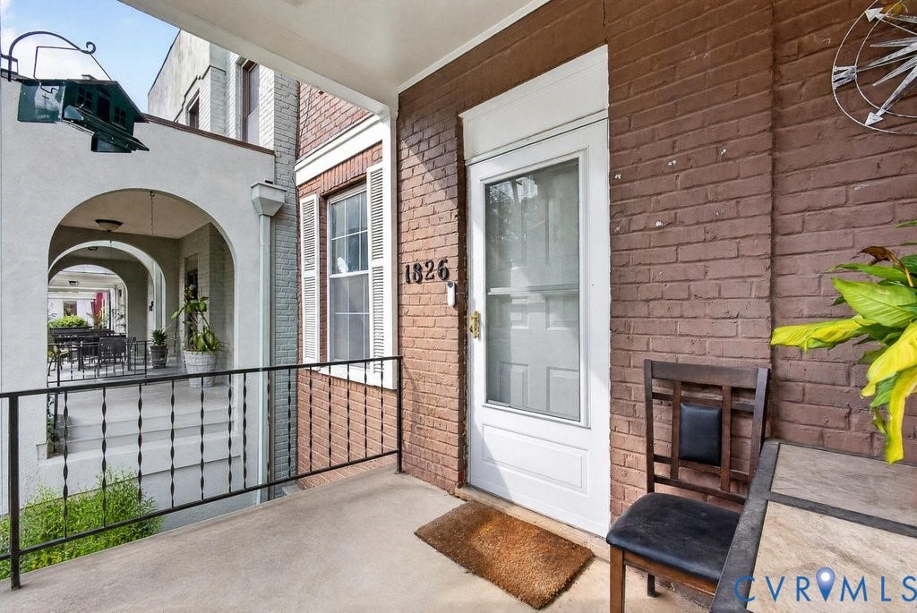 1826 Idlewood Avenue, Randolph, Richmond, VA 23220 Brick facade with white trim around the entry door