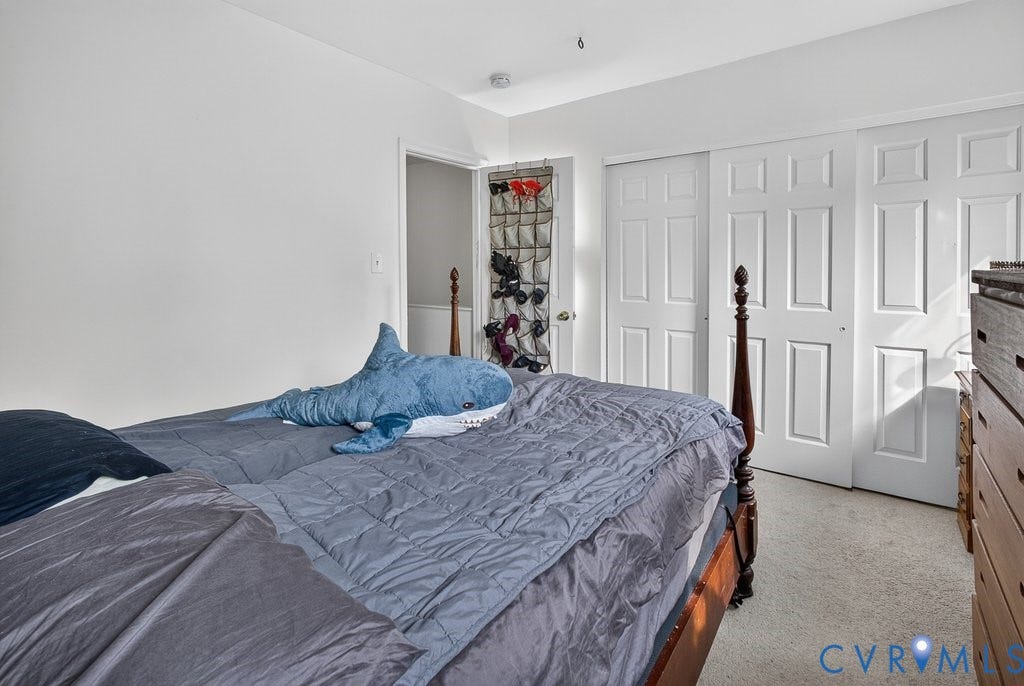 1826 Idlewood Avenue, Randolph, Richmond, VA 23220 Wall-to-wall carpeting, white interior walls, and white sliding closet doors