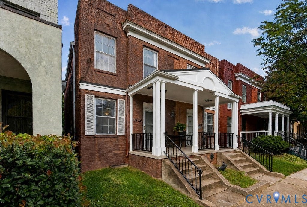 1826 Idlewood Avenue, Randolph, Richmond, VA 23220 Brick facade with white columned front porch and black wrought iron railings