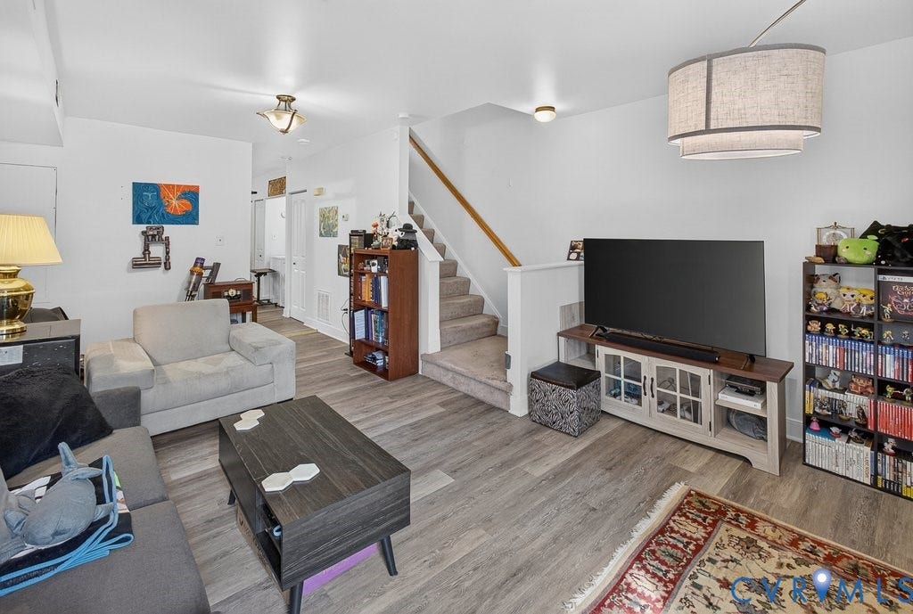 1826 Idlewood Avenue, Randolph, Richmond, VA 23220 Open-concept living space featuring wood-finish flooring, recessed lighting, and a staircase with a wood handrail