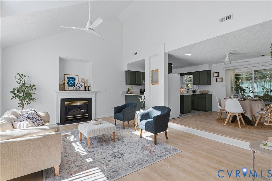 Large living room opening to the eat-in dining area which opens to the rear screened porch.