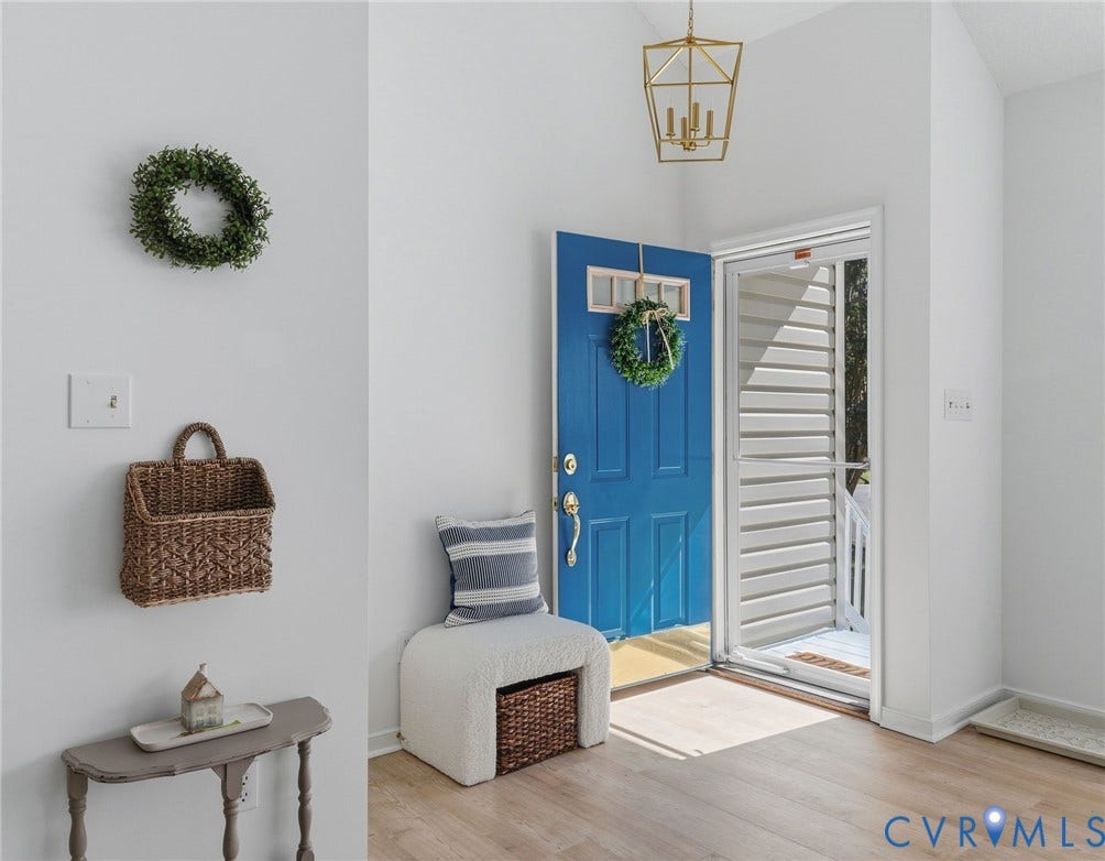 A welcoming foyer with gorgeous natural light, new pendant light fixture,  and brand new LVP flooring to greet you.  A coat closet is directly in front of the door for ease and storage.