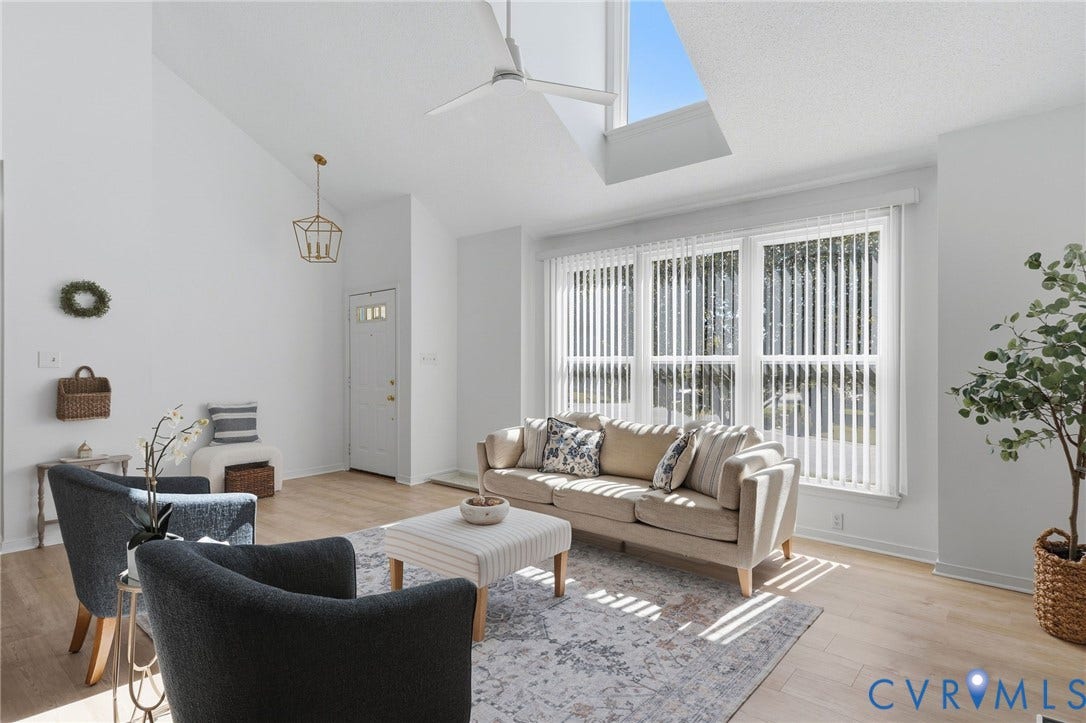 Stunning skylights bring the sunshine into the main living room, flooding it with sunshine.