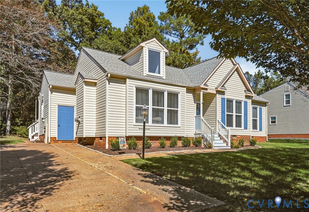 Low maintenance home with vinyl siding and new systems.  Storage shed attached at the front of the home.