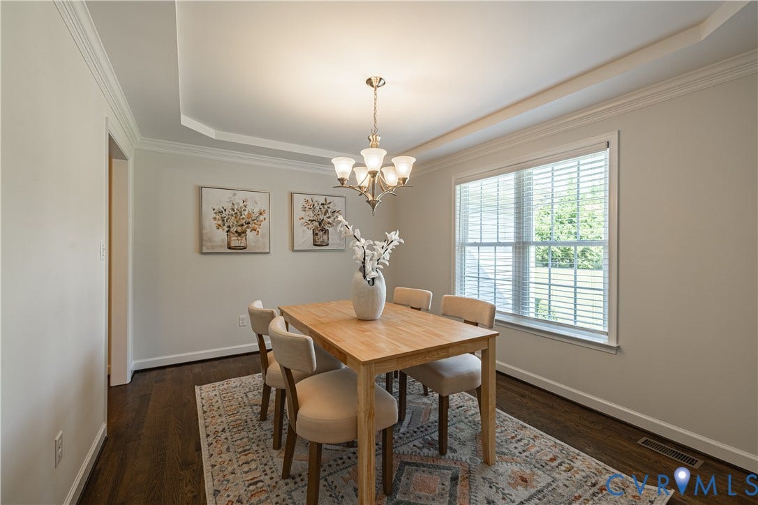 Dark wood-finish flooring with white trim