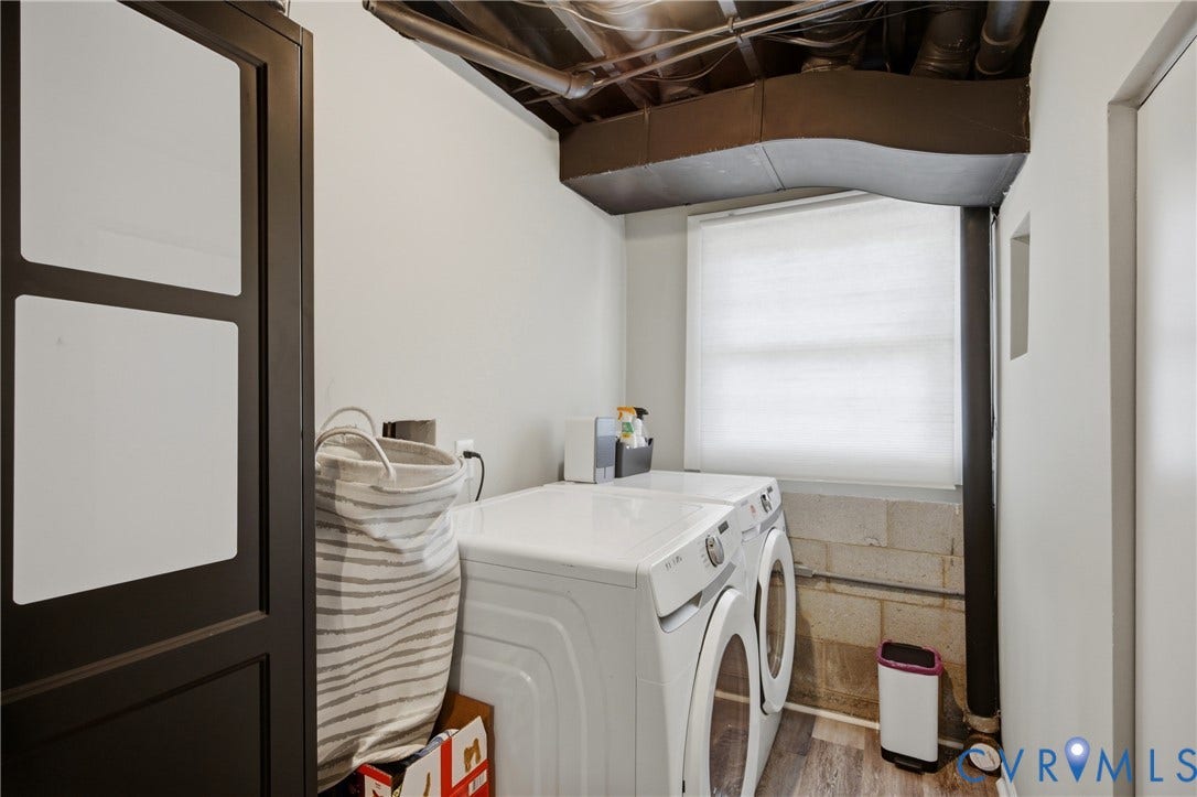 1905 Reagan Road, Henrico, VA 23228 Laundry area featuring a window, wood-finish flooring, and exposed ceiling utilities