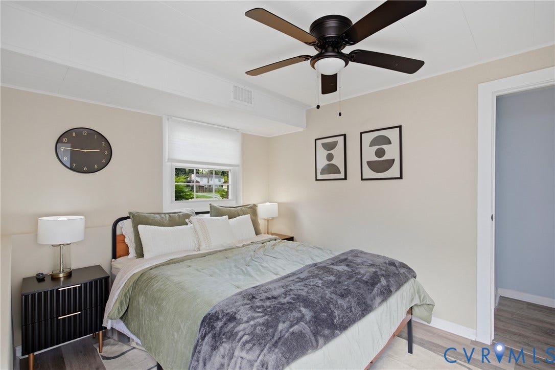 1905 Reagan Road, Henrico, VA 23228 Ceiling fan with light fixture, window with white blind, light wood-finish flooring, white trim, and a door frame