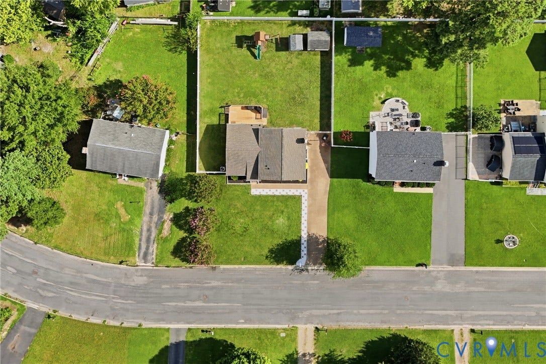 1905 Reagan Road, Henrico, VA 23228 Property featuring an expansive green lawn, asphalt driveway, and mature trees