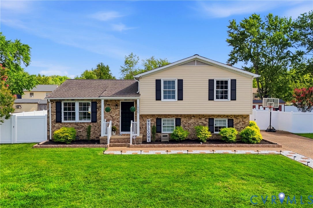 1905 Reagan Road, Henrico, VA 23228 Brick and siding exterior with dark shutters, white front porch railing, and a defined front walkway