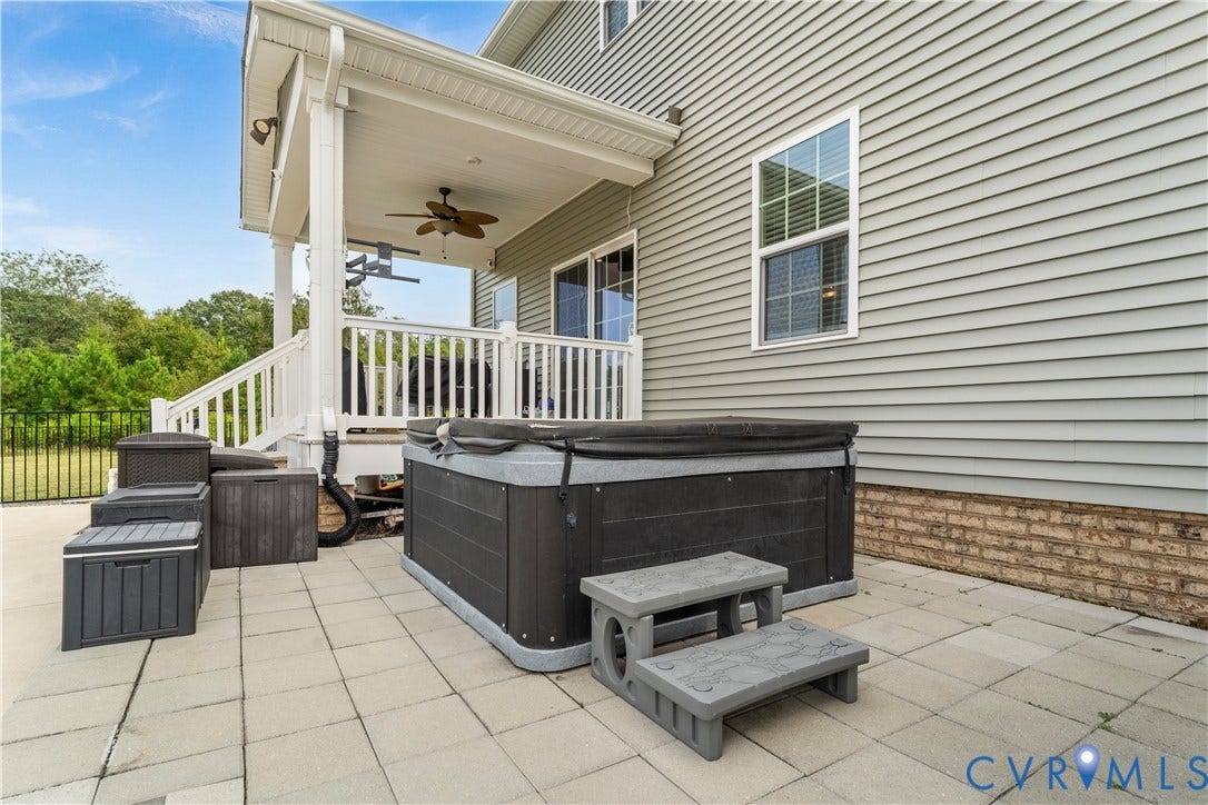 11707 Amara Drive, Chester / Highlands Golf Club, Chesterfield, VA 23838 Paved patio featuring a hot tub with steps, covered porch with a ceiling fan, white railings, and siding exterior