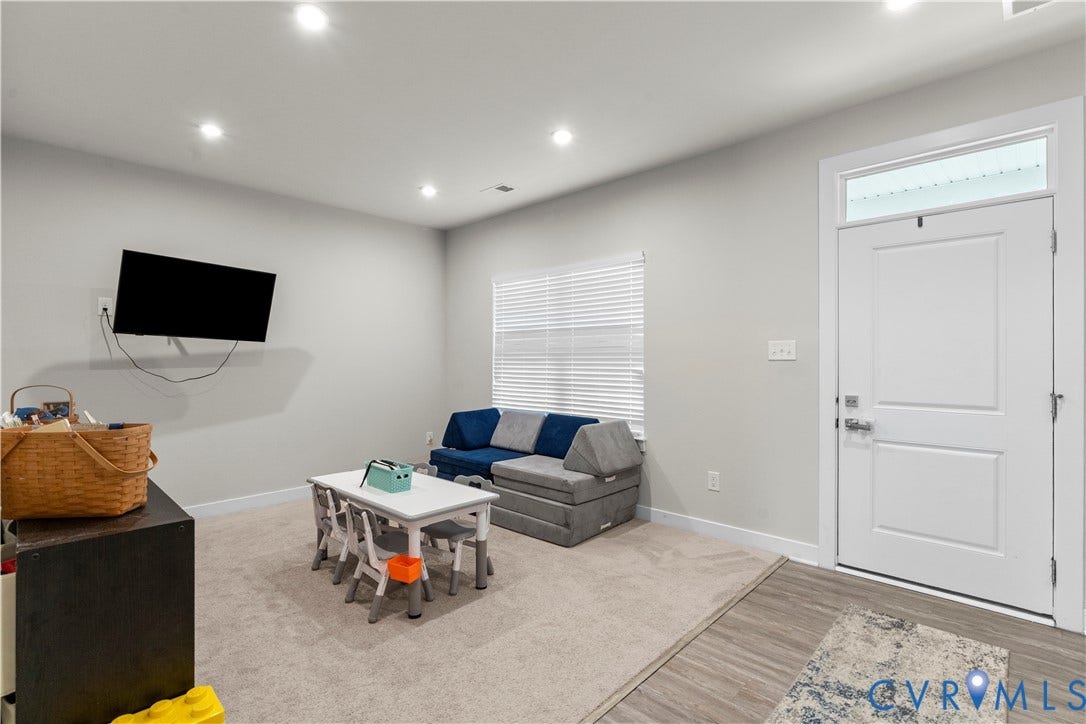 11707 Amara Drive, Chester / Highlands Golf Club, Chesterfield, VA 23838 Recessed lighting, light gray wall paint, carpeting, a window with blinds, and a white door with transom window