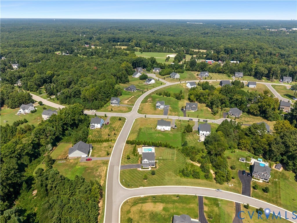 11707 Amara Drive, Chester / Highlands Golf Club, Chesterfield, VA 23838 Expansive residential area featuring established homes, paved roads, and significant surrounding tree coverage