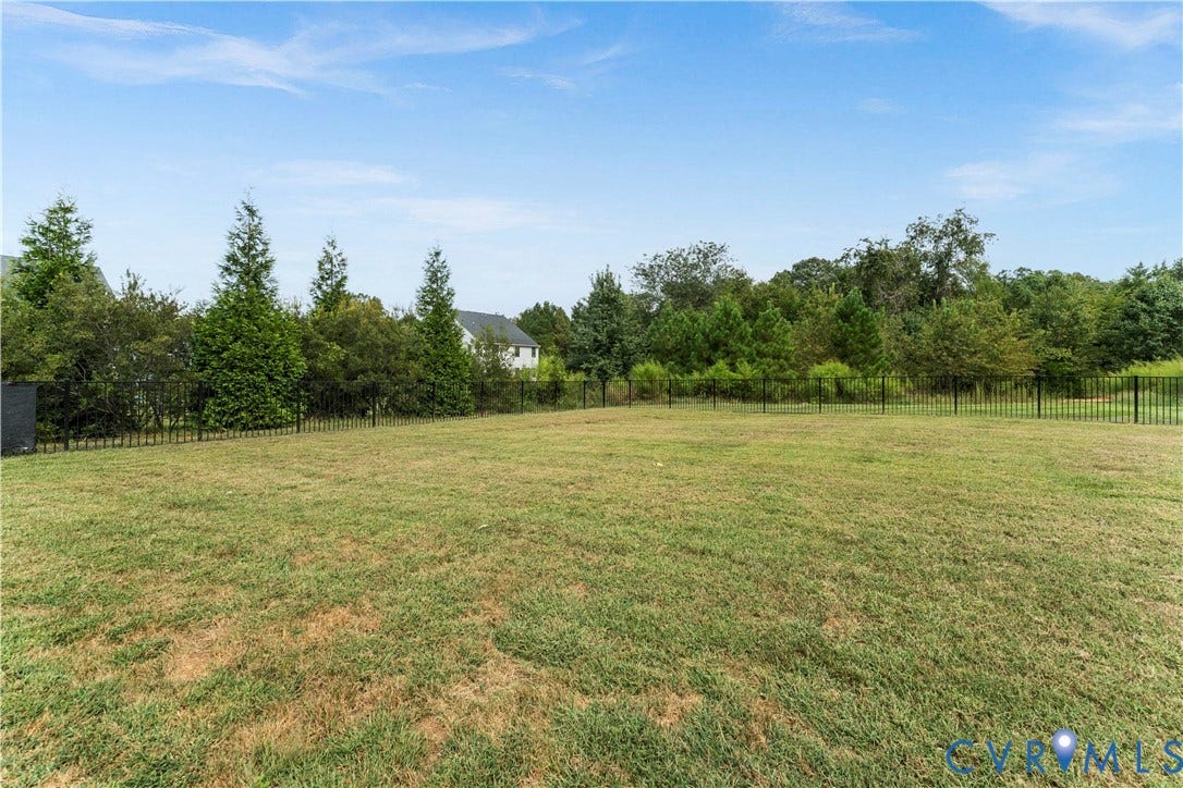 11707 Amara Drive, Chester / Highlands Golf Club, Chesterfield, VA 23838 Expansive lawn with perimeter fencing and mature trees