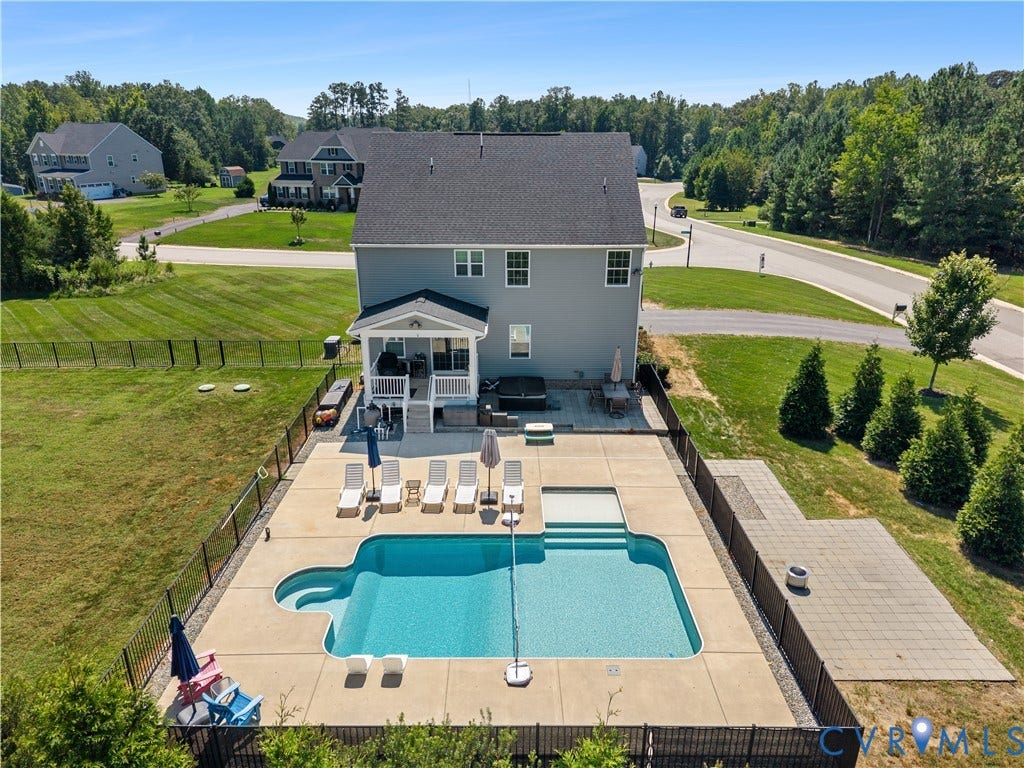 11707 Amara Drive, Chester / Highlands Golf Club, Chesterfield, VA 23838 Expansive backyard oasis featuring a resort-style in-ground pool with sun lounging deck, mature landscaping with privacy plantings, and manicured lawn