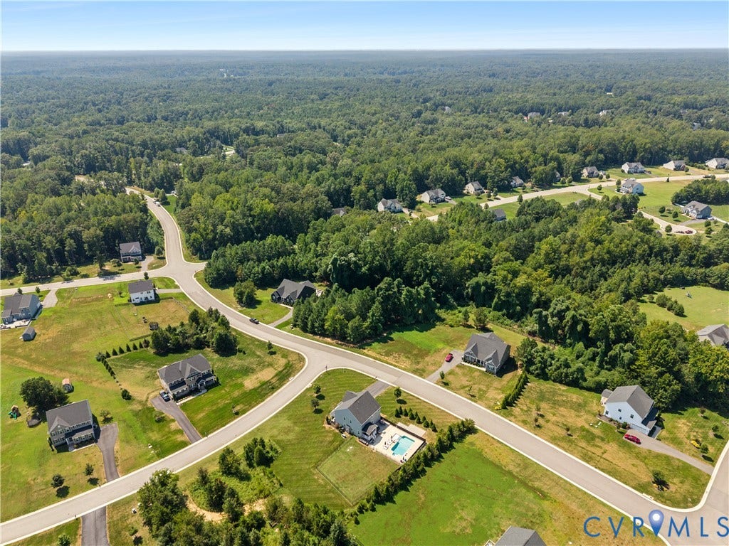 11707 Amara Drive, Chester / Highlands Golf Club, Chesterfield, VA 23838 Expansive residential development featuring paved roads and a surrounding wooded landscape