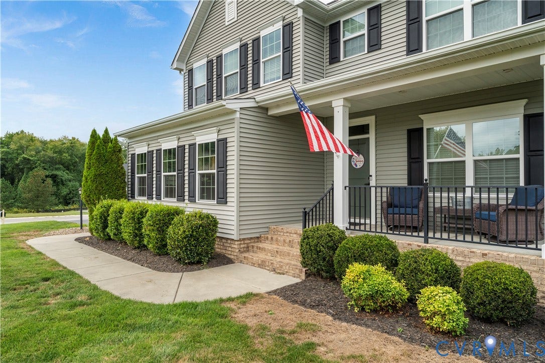 11707 Amara Drive, Chester / Highlands Golf Club, Chesterfield, VA 23838 Siding exterior with contrasting dark window shutters, covered front porch, and brick foundation