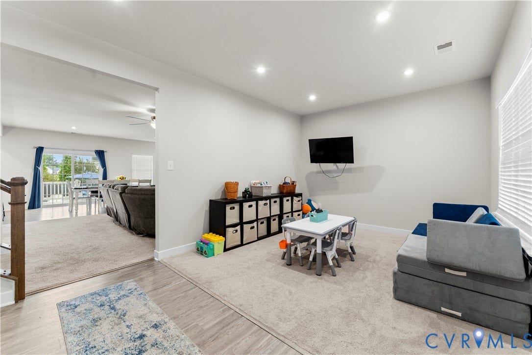 11707 Amara Drive, Chester / Highlands Golf Club, Chesterfield, VA 23838 Recessed lighting illuminating a carpeted room with light-colored walls and a window with horizontal blinds