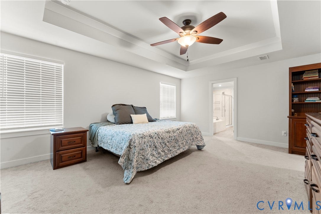 11707 Amara Drive, Chester / Highlands Golf Club, Chesterfield, VA 23838 Tray ceiling, ceiling fan with light fixture, light-colored carpeting, white window blinds, and built-in shelving