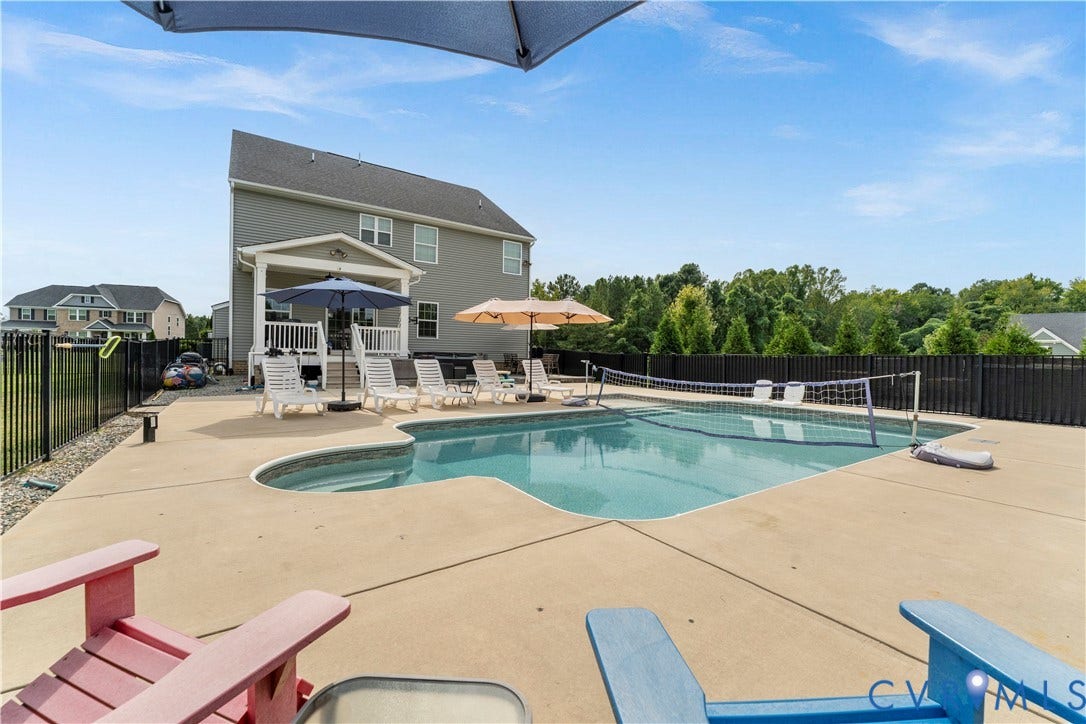 11707 Amara Drive, Chester / Highlands Golf Club, Chesterfield, VA 23838 Two-story residence with a patio, in-ground swimming pool, and black metal fencing