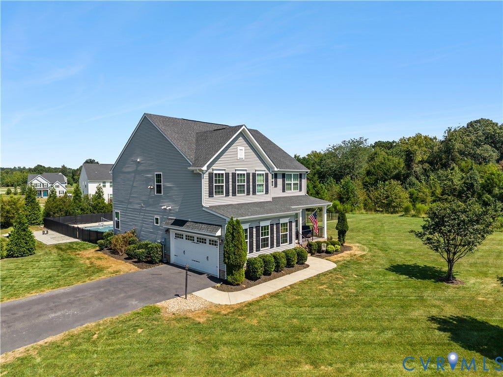 11707 Amara Drive, Chester / Highlands Golf Club, Chesterfield, VA 23838 Two-story residence featuring a gray exterior, a covered front porch, and a two-car garage