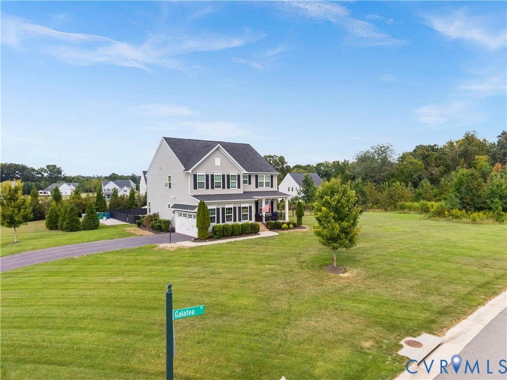 11707 Amara Drive, Chester / Highlands Golf Club, Chesterfield, VA 23838 Two-story residence with a gray facade, dark shutters, and a covered porch