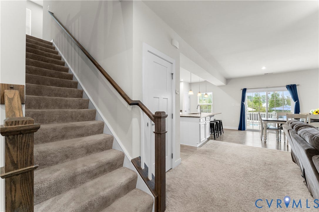 11707 Amara Drive, Chester / Highlands Golf Club, Chesterfield, VA 23838 Carpeted staircase with wood-finish handrail and newel post