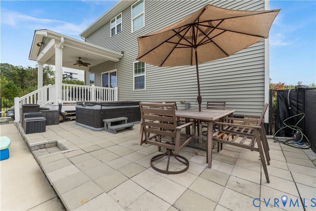 11707 Amara Drive, Chester / Highlands Golf Club, Chesterfield, VA 23838 Expansive paver patio with covered porch, hot tub, and exterior siding