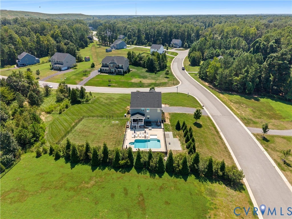 11707 Amara Drive, Chester / Highlands Golf Club, Chesterfield, VA 23838 In-ground swimming pool with surrounding hardscape, privacy fencing, and mature landscaping