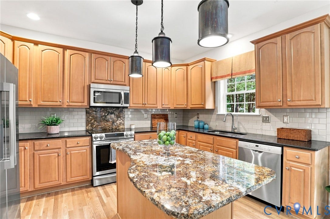Wood-finish flooring with light wood cabinetry