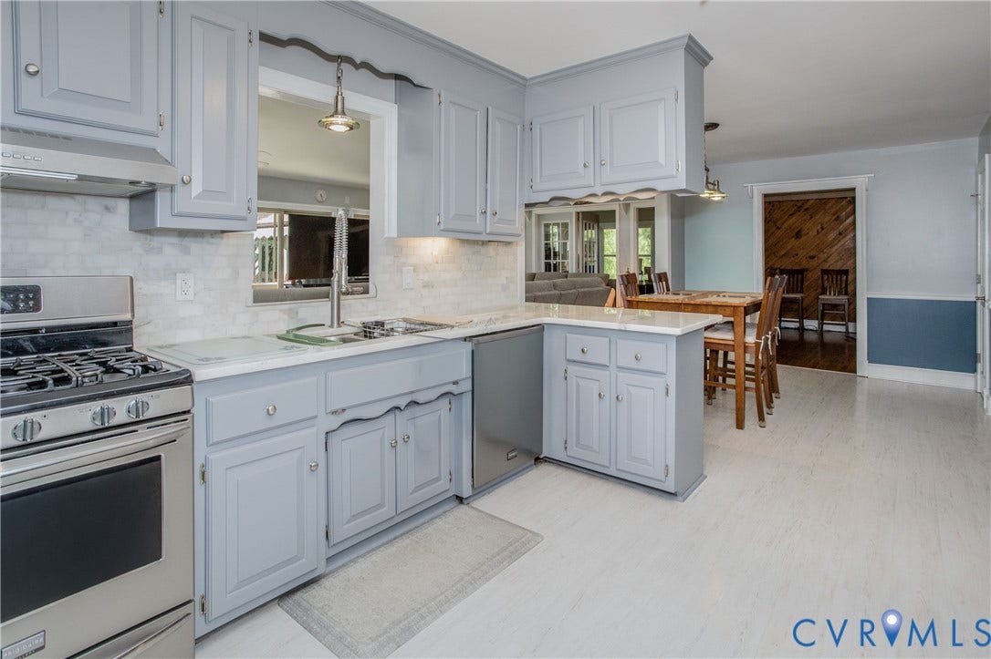 14530 Fox Knoll Drive, South Chesterfield, VA 23834 Kitchen featuring light gray cabinetry, stainless steel appliances, a white tile backsplash, and light-toned flooring
