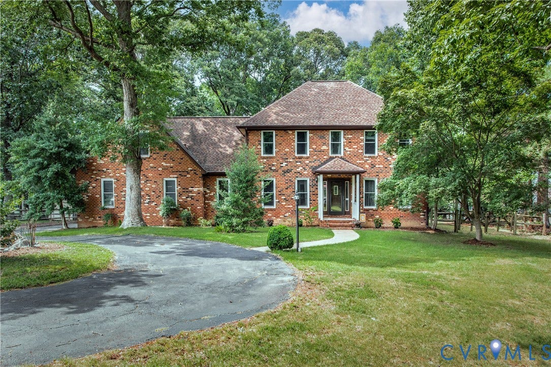 14530 Fox Knoll Drive, South Chesterfield, VA 23834 Brick exterior with multiple windows, covered entry, and a paved driveway