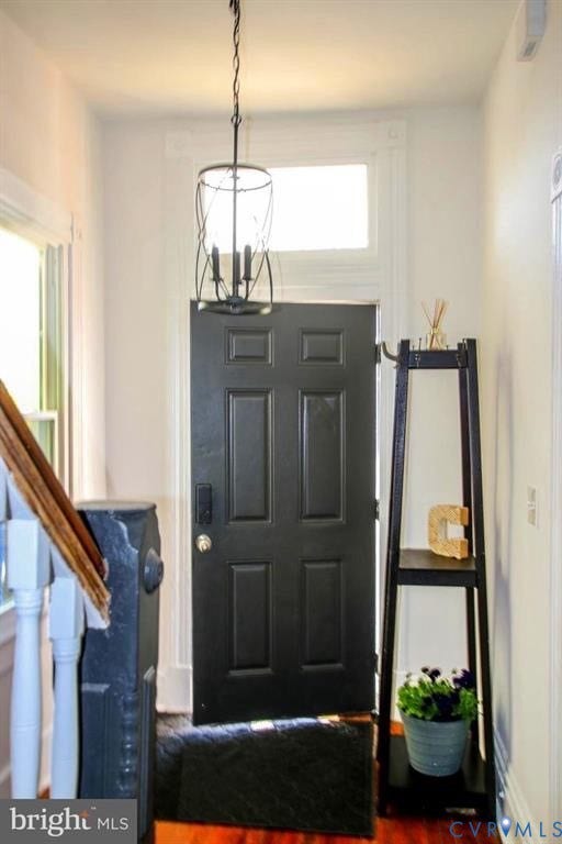 1910 W Main Street, The Historic Fan District, Richmond, VA 23220 Paneled entry door with transom window, detailed newel post, and wood-finish flooring