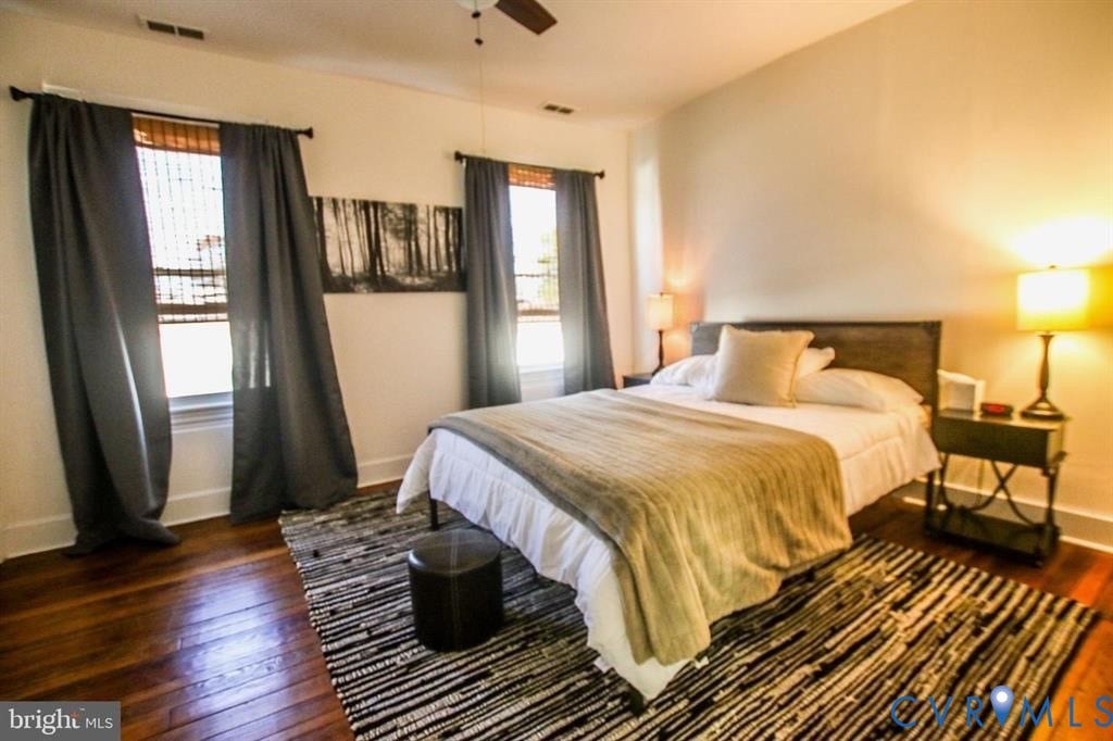 1910 W Main Street, The Historic Fan District, Richmond, VA 23220 Hardwood flooring, two windows with window treatments, and a ceiling fan