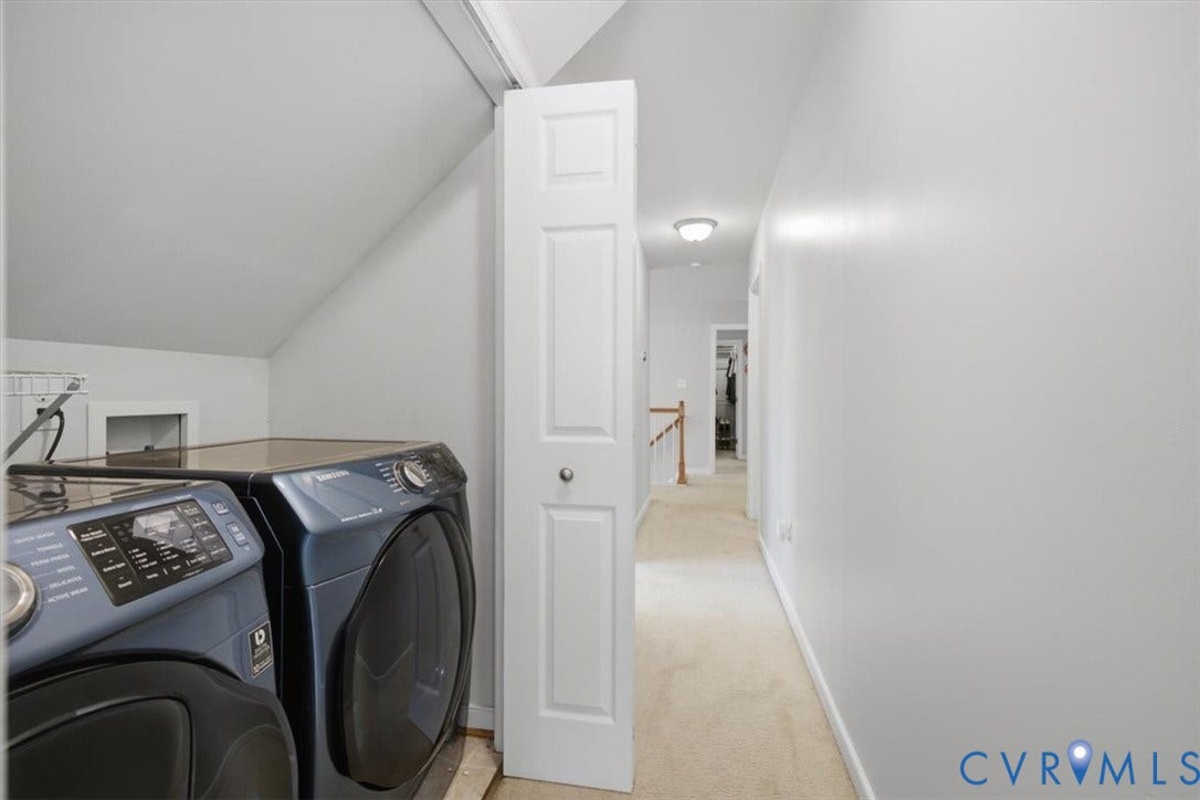 Side by side washer dryer in hallway that convey