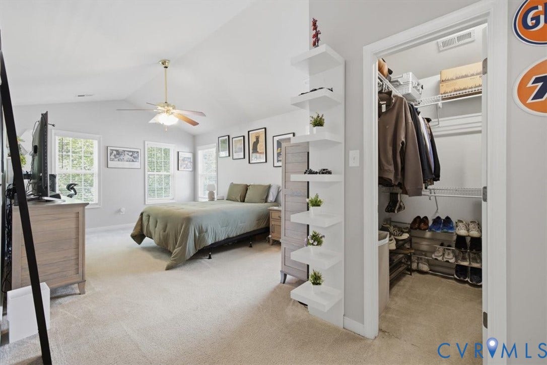 Large primary with vaulted ceiling, walk in closet