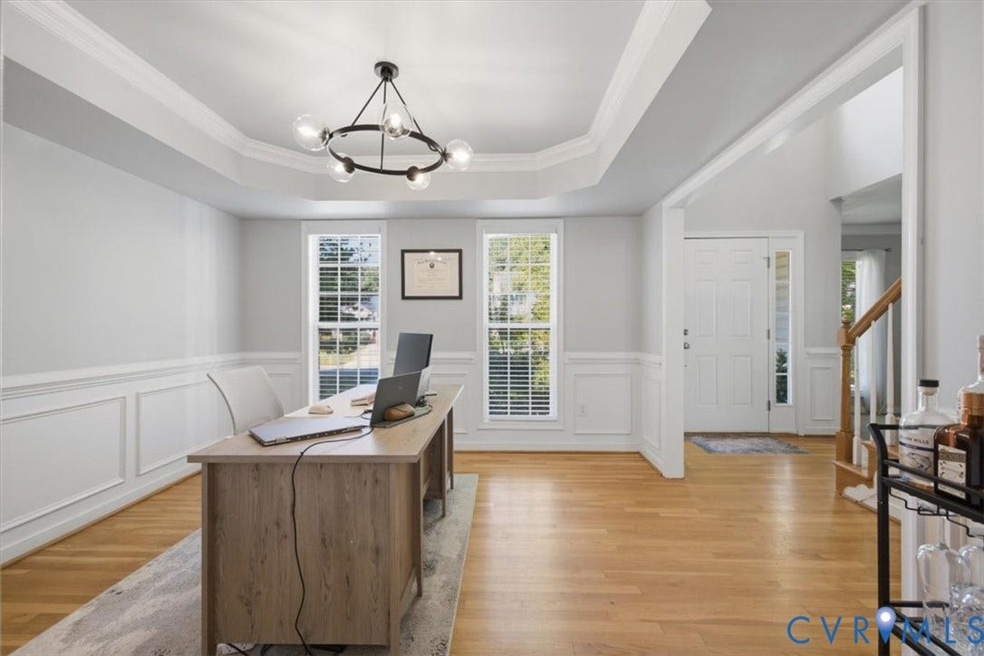 Trey ceiling, picture frame molding, wood floors. Currently used as office.