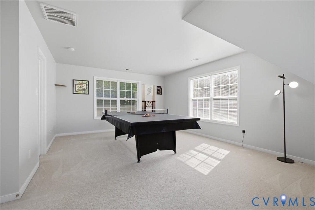 Bedroom 4 with large walk in closet, abundant natural light.  Currently used as gameroom