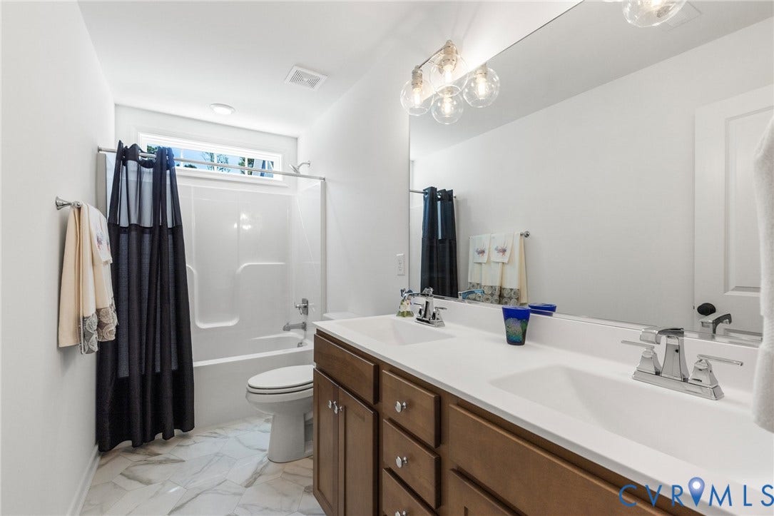 12906 Craftsbury Court, Midlothian, VA 23112 Dual sink vanity with wood-finish cabinetry and white countertops