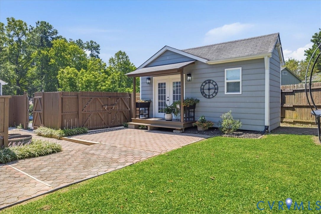 7900 Valencia Road, Chesterfield, VA 23832 Gray siding exterior with white trim, a gabled roof, and a covered porch