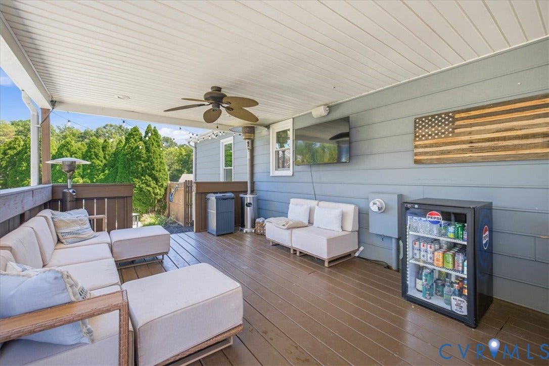 7900 Valencia Road, Chesterfield, VA 23832 Covered outdoor deck with wood-finish flooring, a ceiling fan, and painted siding