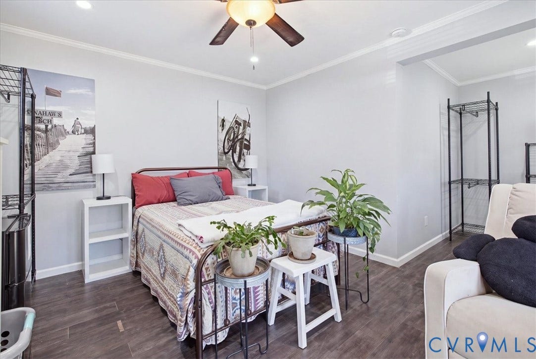 7900 Valencia Road, Chesterfield, VA 23832 Wood-finish flooring, crown molding, a ceiling fan with integrated lighting, and recessed ceiling lights