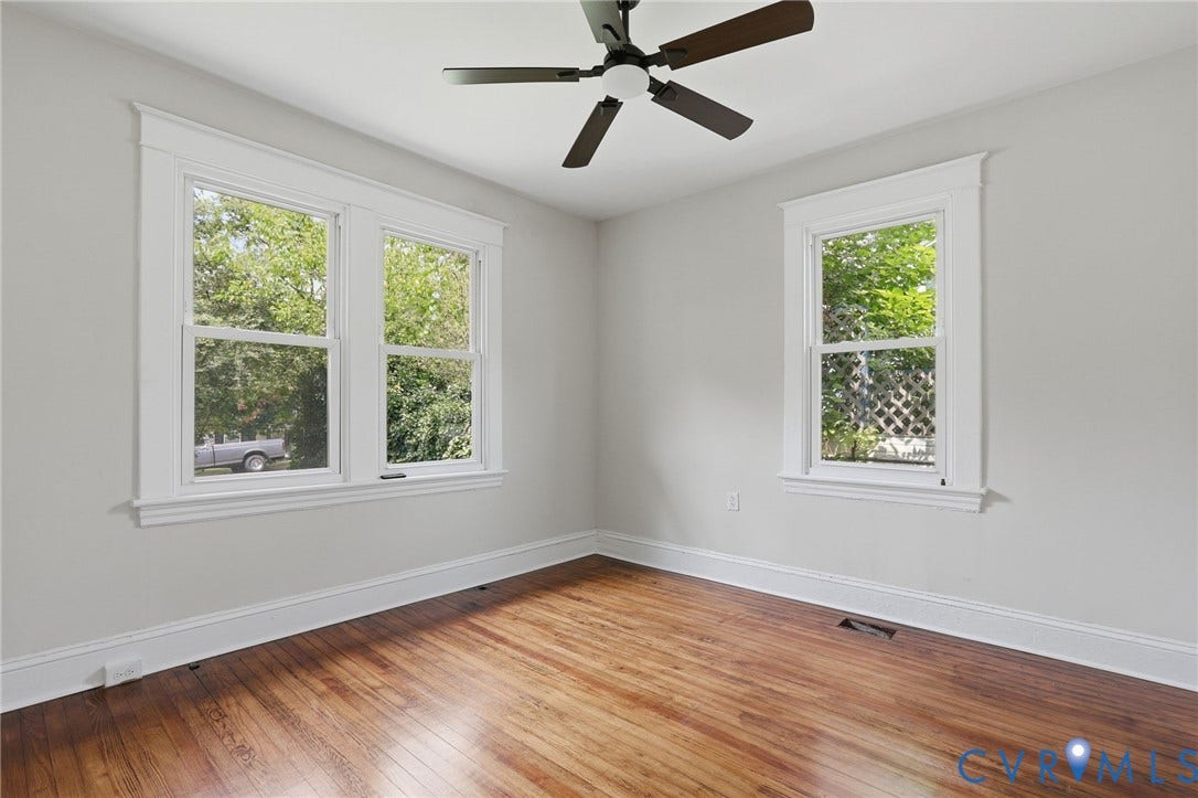 1815 Carlisle Avenue, Richmond, VA 23231 Hardwood flooring, crisp white trim, double-hung windows, ceiling fan with wood-finish blades, and light gray wall paint